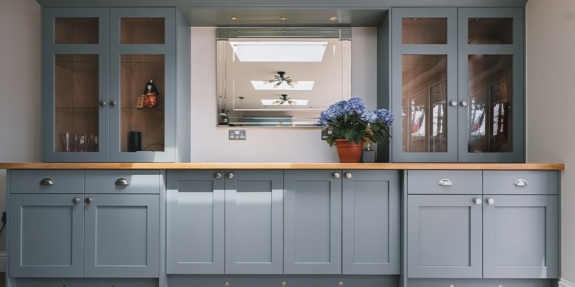 Dining room cabinetry and storage in grey blue traditional shaker style
