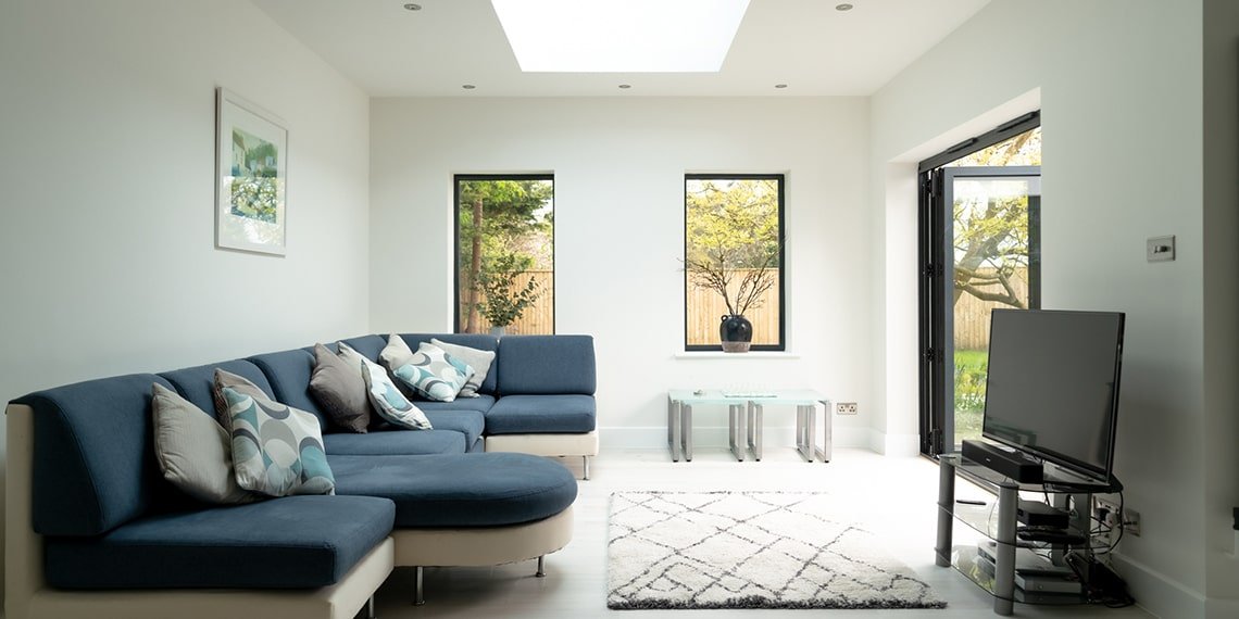 Living room with soft natural light from the roof lantern