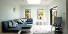 Living room with soft natural light from the roof lantern