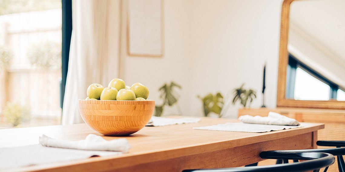 Bowl of Green Apples on a Table