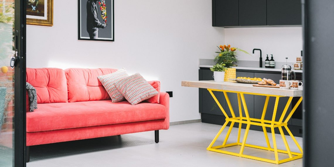Red Sofa and Kitchen Table with a Yellow Frame