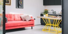 Red Sofa and Kitchen Table with a Yellow Frame