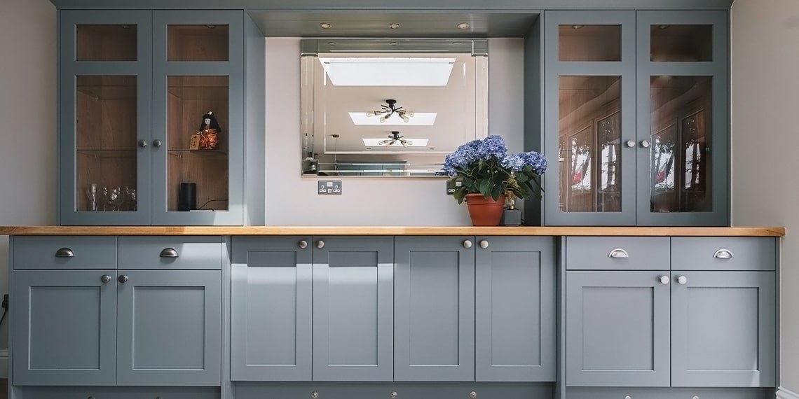 Dining room cabinetry and storage in grey blue traditional shaker style